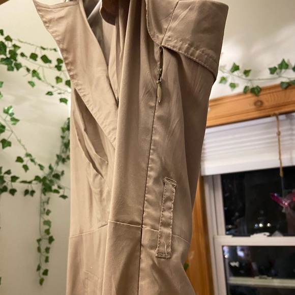 Tan trench coat style dress. Has pockets and zips up the side. - Picture 2 of 3